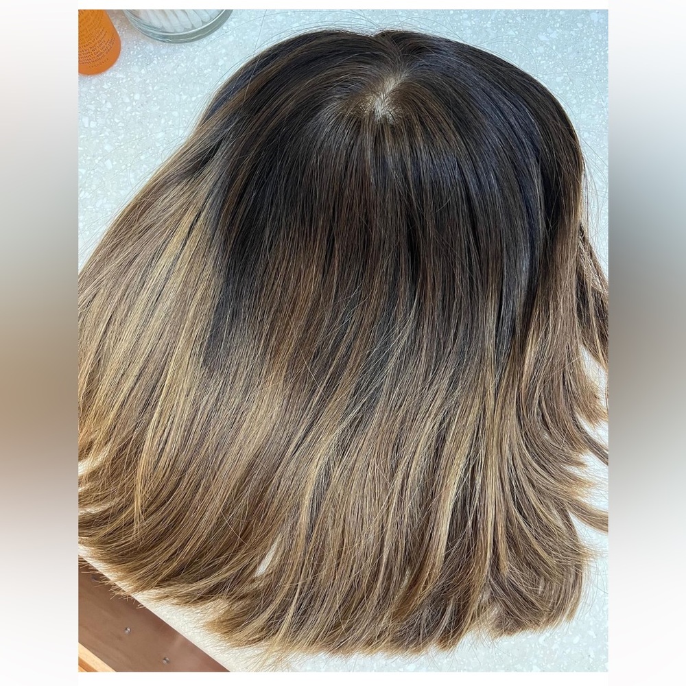 Highlines hair topper. Dark brown root with light ends.
